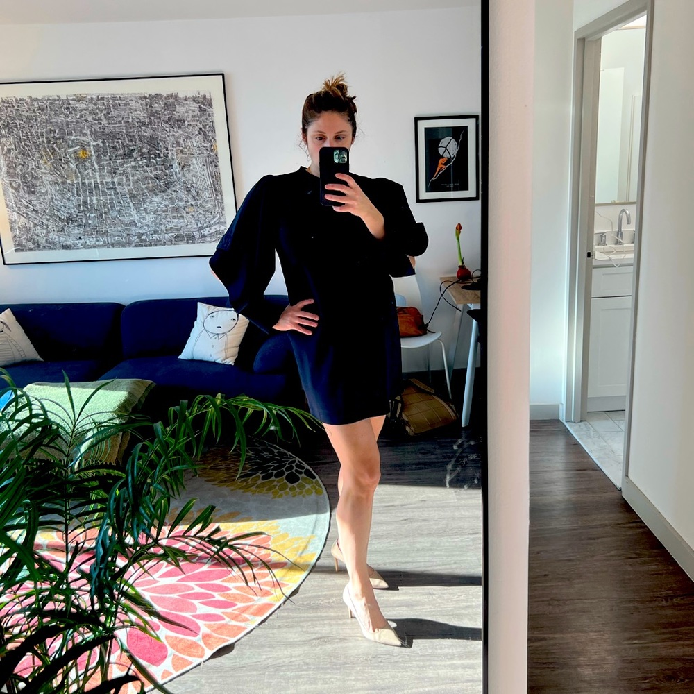 Cocktail length navy blue Marnie dress with cut out sleeves. Size 8.